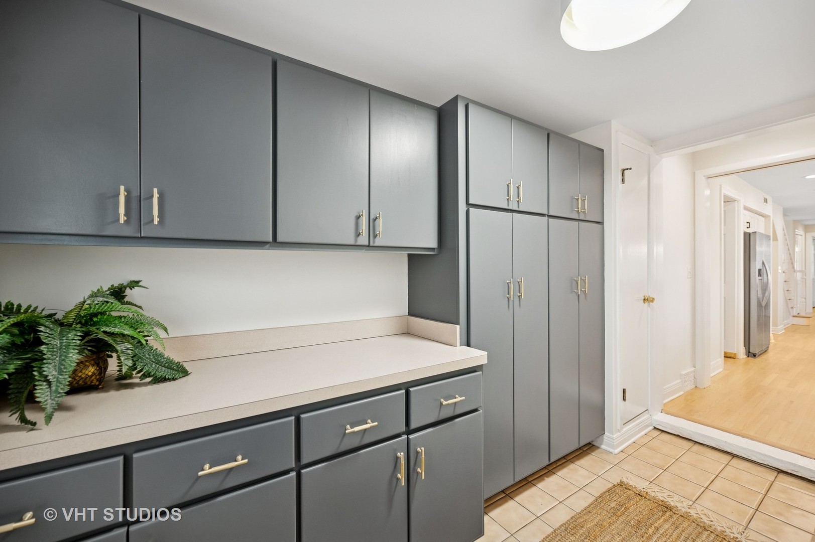 630 Juniper Road Glenview, IL 60025 - Photo 11 of 52 a kitchen with a refrigerator and cabinets