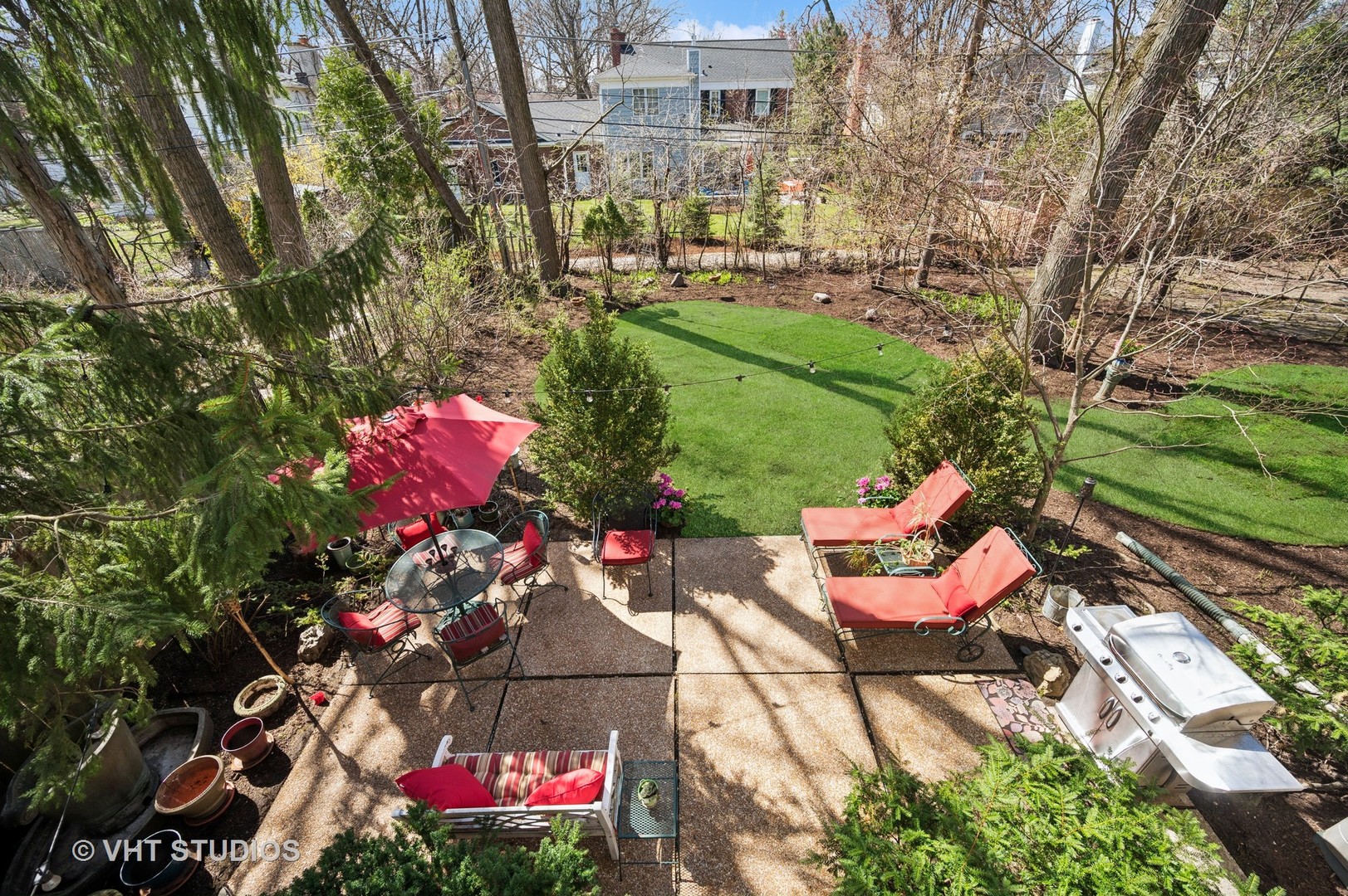 630 Juniper Road Glenview, IL 60025 - Photo 19 of 52 a backyard of a house with lots of green space and a fountain