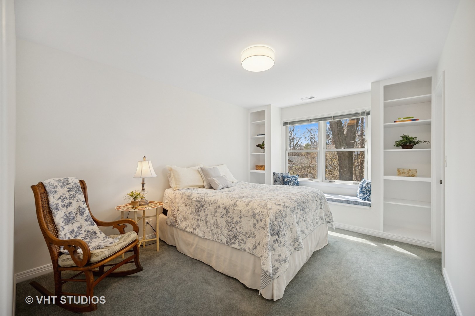 630 Juniper Road Glenview, IL 60025 - Photo 23 of 52 a room with a bed and a couch