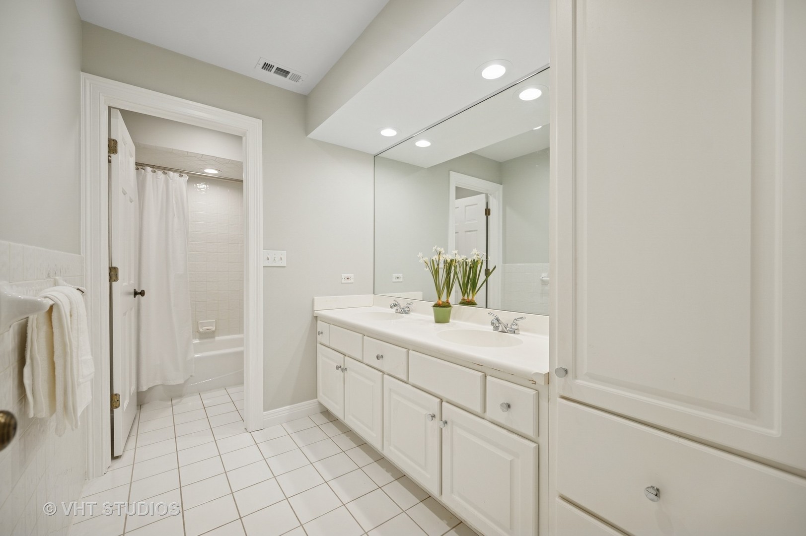 630 Juniper Road Glenview, IL 60025 - Photo 28 of 52 a bathroom with a sink a toilet and shower