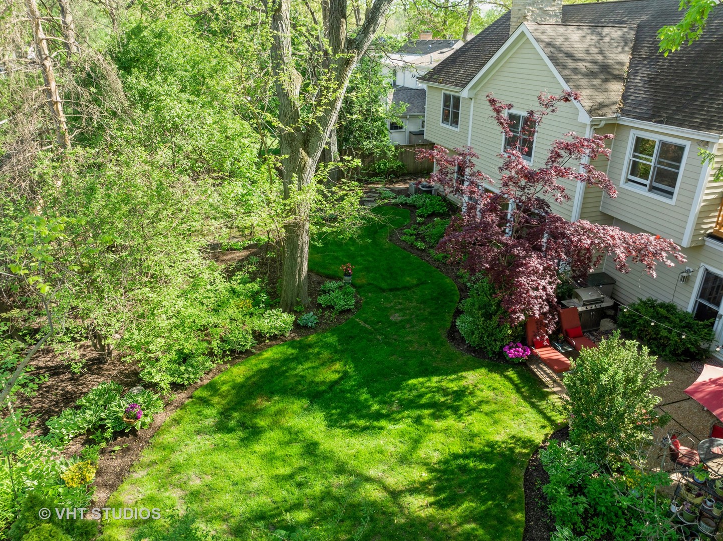 630 Juniper Road Glenview, IL 60025 - Photo 3 of 52 a view of a house with a yard and garden