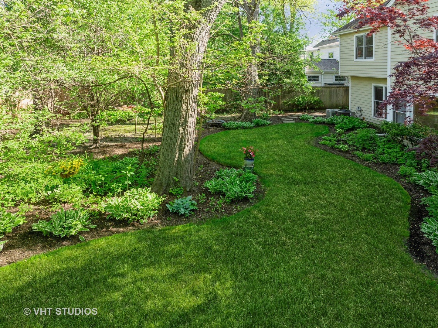 630 Juniper Road Glenview, IL 60025 - Photo 35 of 52 a view of a garden with a building in the background