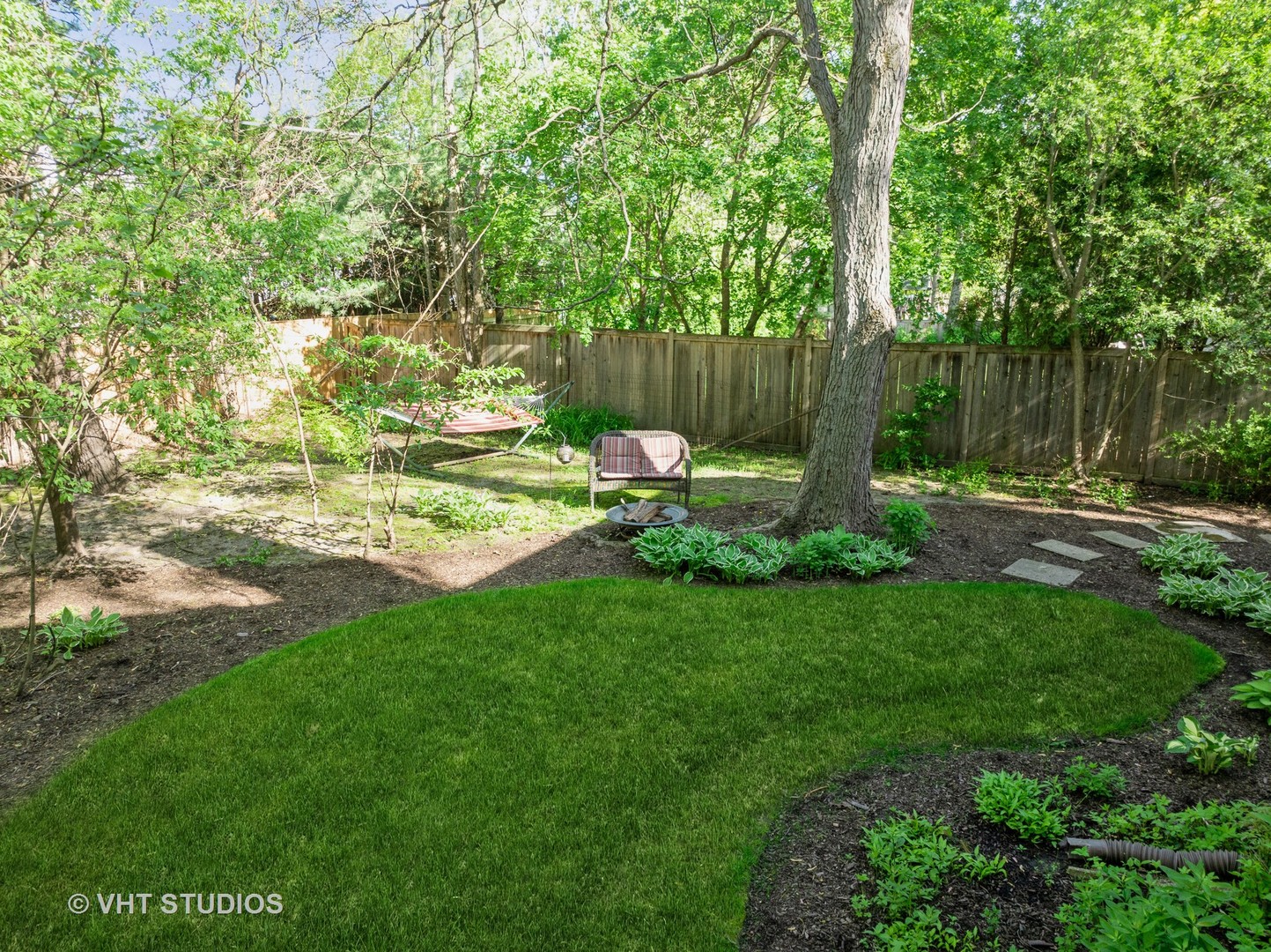 630 Juniper Road Glenview, IL 60025 - Photo 36 of 52 a view of backyard with table and chairs and wooden fence