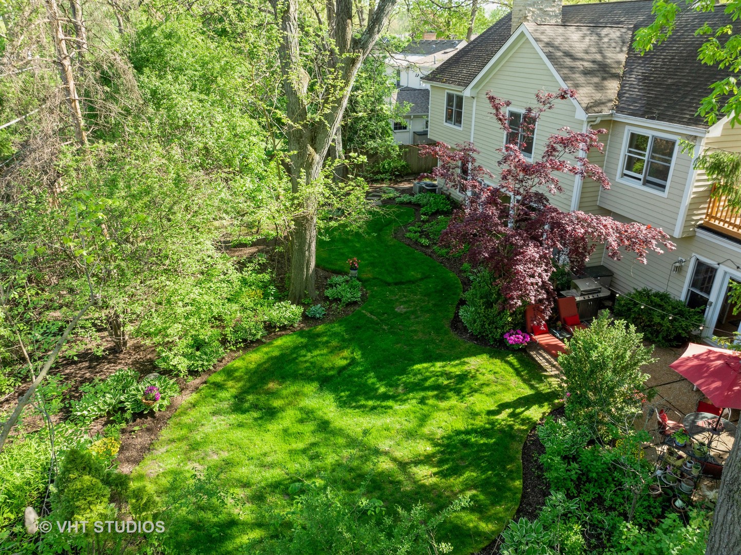 630 Juniper Road Glenview, IL 60025 - Photo 37 of 52 a view of a house with a yard and garden