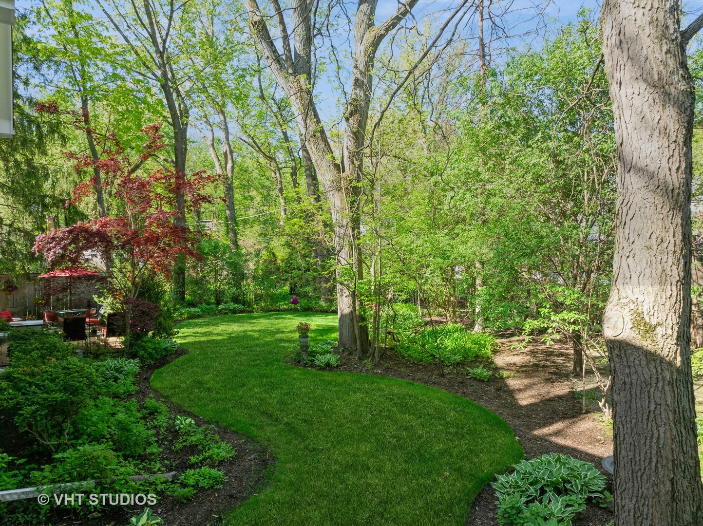 630 Juniper Road Glenview, IL 60025 - Photo 4 of 52 a view of a yard with a tree