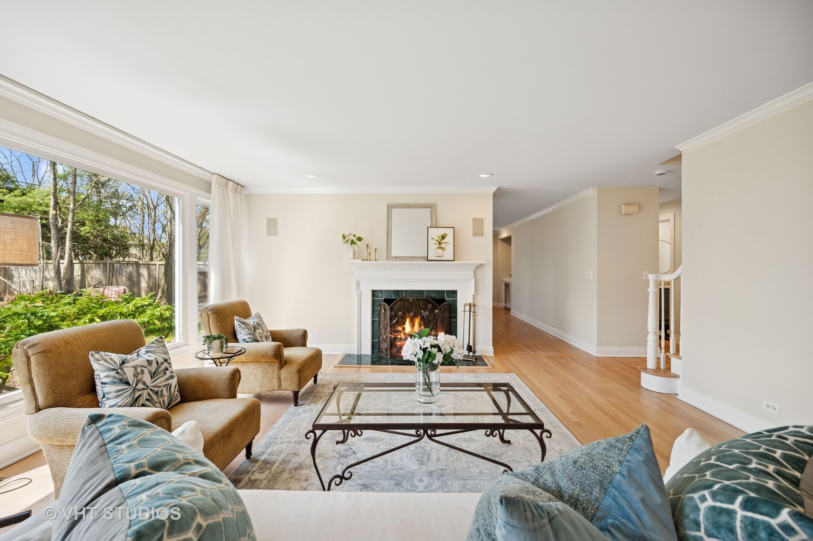 630 Juniper Road Glenview, IL 60025 - Photo 6 of 52 a living room with furniture a fireplace and a large window