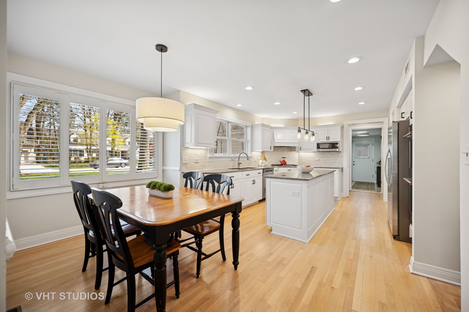 630 Juniper Road Glenview, IL 60025 - Photo 10 of 52 a large kitchen with a table and chairs