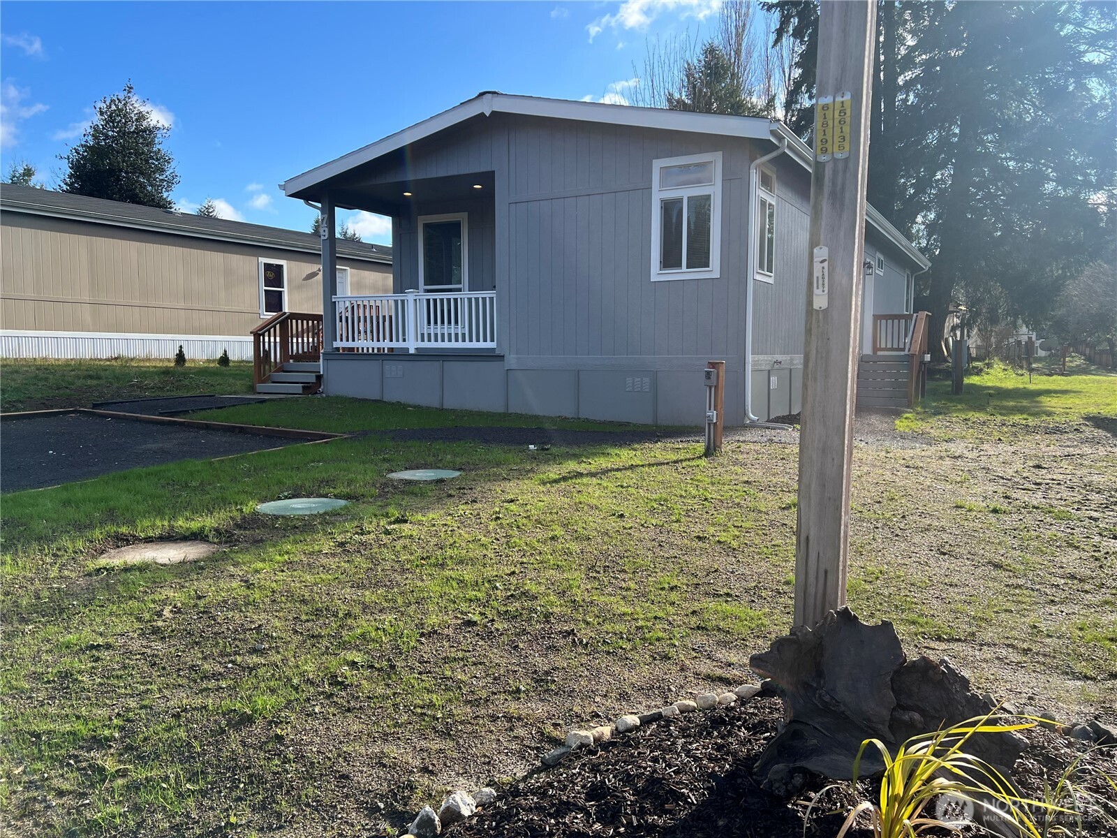 3371 Southeast Bielmeier Road, Unit 79 Port Orchard, WA 98367 - Photo 1 of 16 a view of a house with backyard