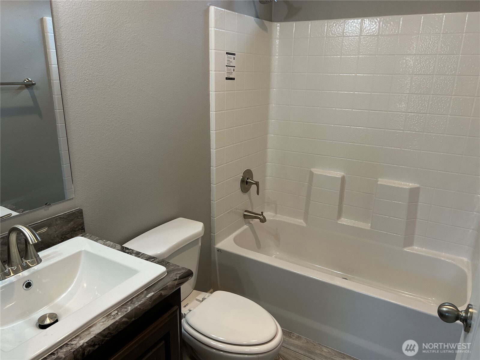 3371 Southeast Bielmeier Road, Unit 79 Port Orchard, WA 98367 - Photo 14 of 16 a bathroom with a sink toilet and shower