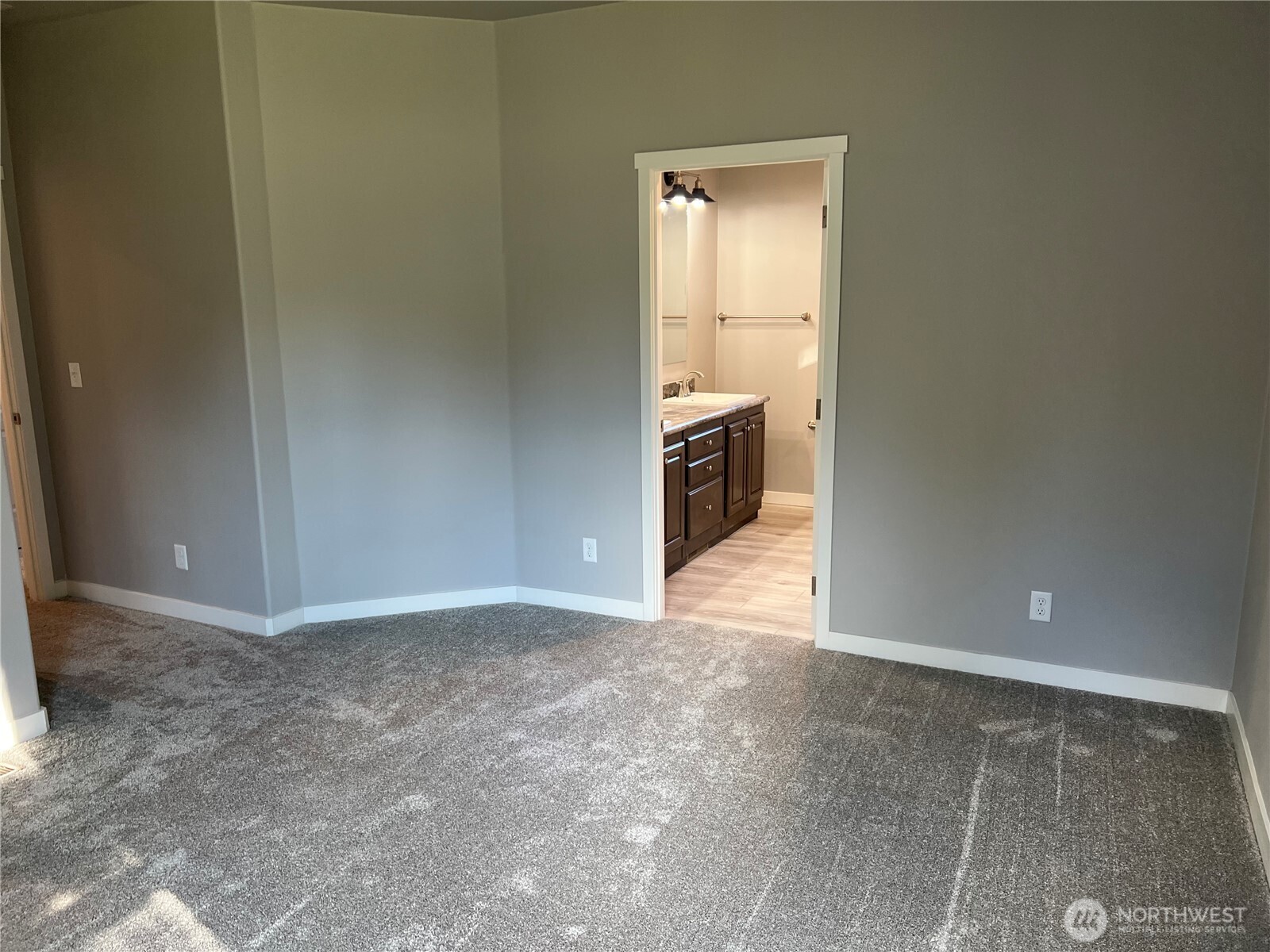 3371 Southeast Bielmeier Road, Unit 79 Port Orchard, WA 98367 - Photo 8 of 16 a view of a kitchen with a sink and a refrigerator