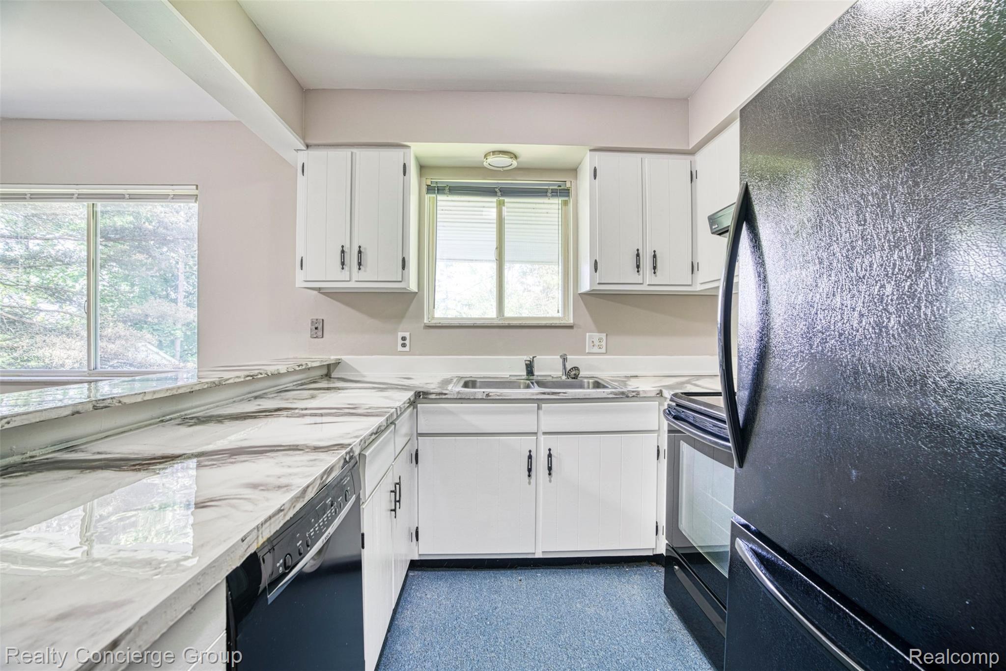 6505 Byron Road Howell, MI 48855 - Photo 2 of 20 Open concept kitchen with tons of counterspace and freshly painted & upgraded cabinets.