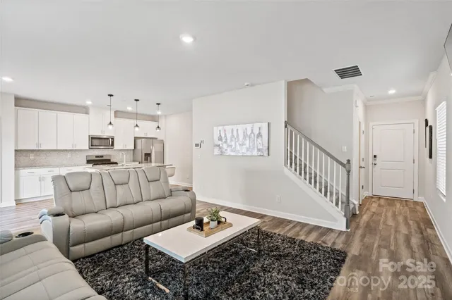 a living room with furniture and a rug