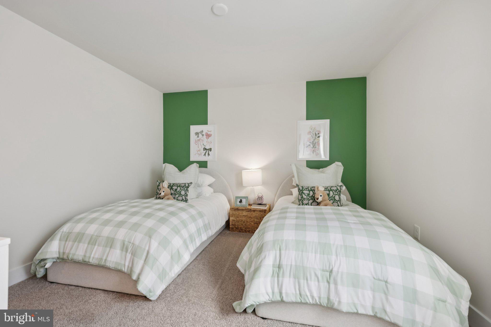 116 Trellis View Lane Winchester, VA 22602 - Photo 24 of 42 a bedroom with two beds and lamp
