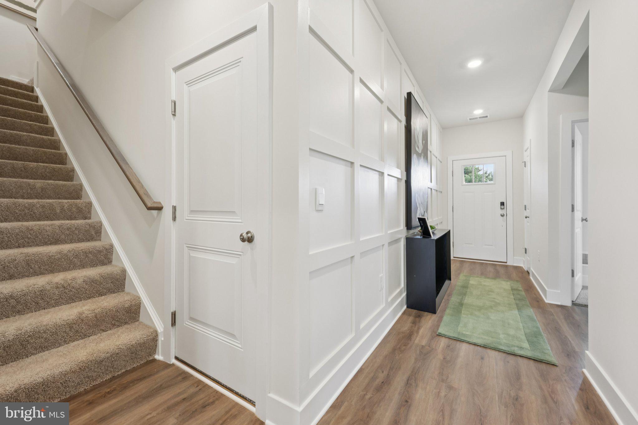 116 Trellis View Lane Winchester, VA 22602 - Photo 5 of 42 a view of a hallway with wooden floor and staircase