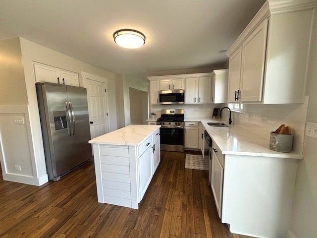 508 Ramsden Road Plano, IL 60545 - Photo 7 of 20 a kitchen with a refrigerator a stove top oven a sink dishwasher and wooden floor