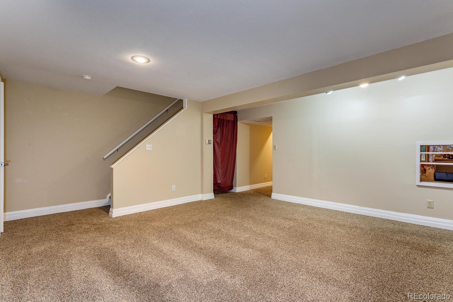9869 Spring Hill Drive Highlands Ranch, CO 80129 - Photo 22 of 37 a view of an empty room with a window