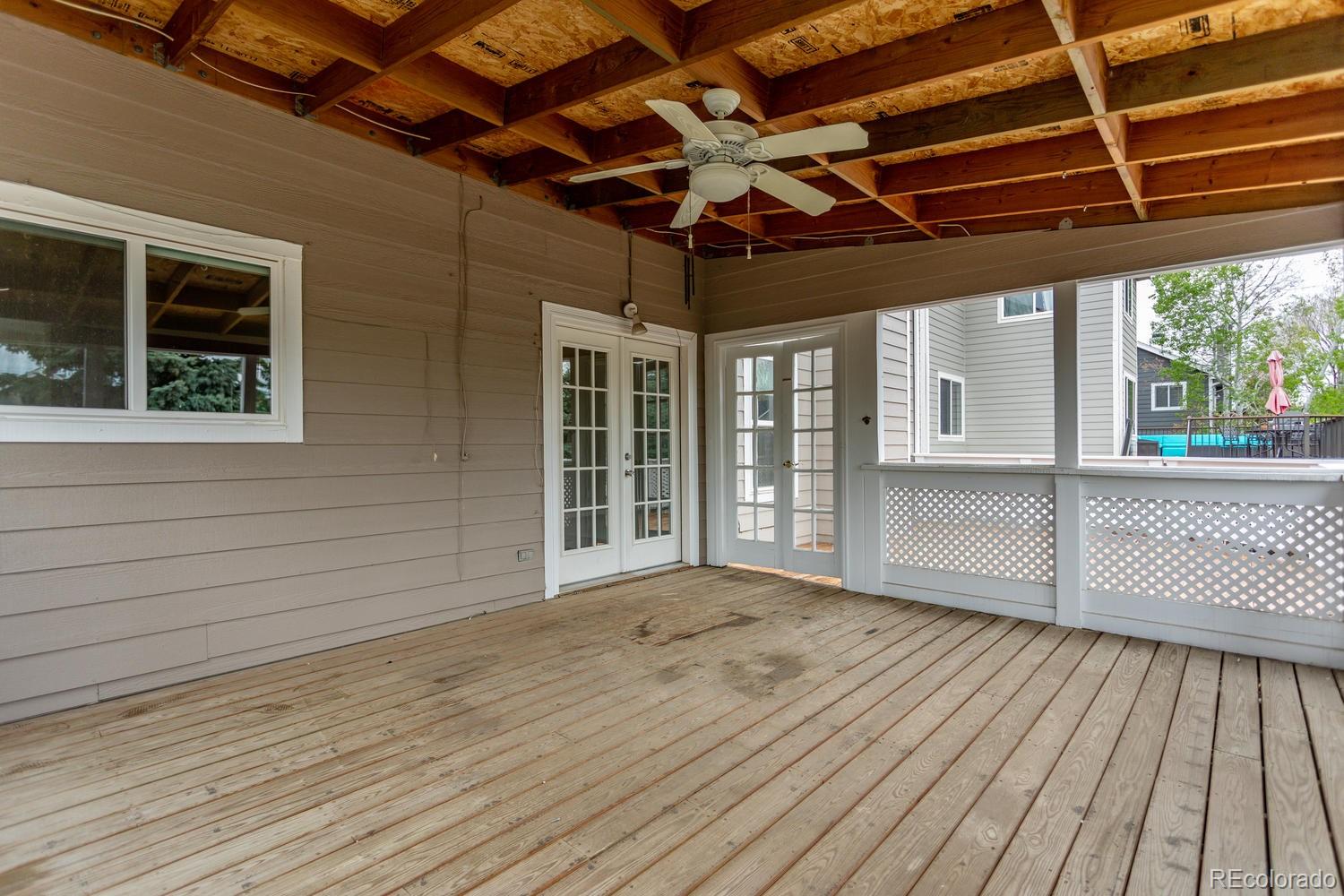 9869 Spring Hill Drive Highlands Ranch, CO 80129 - Photo 29 of 37 a view of empty room with wooden floor and fan