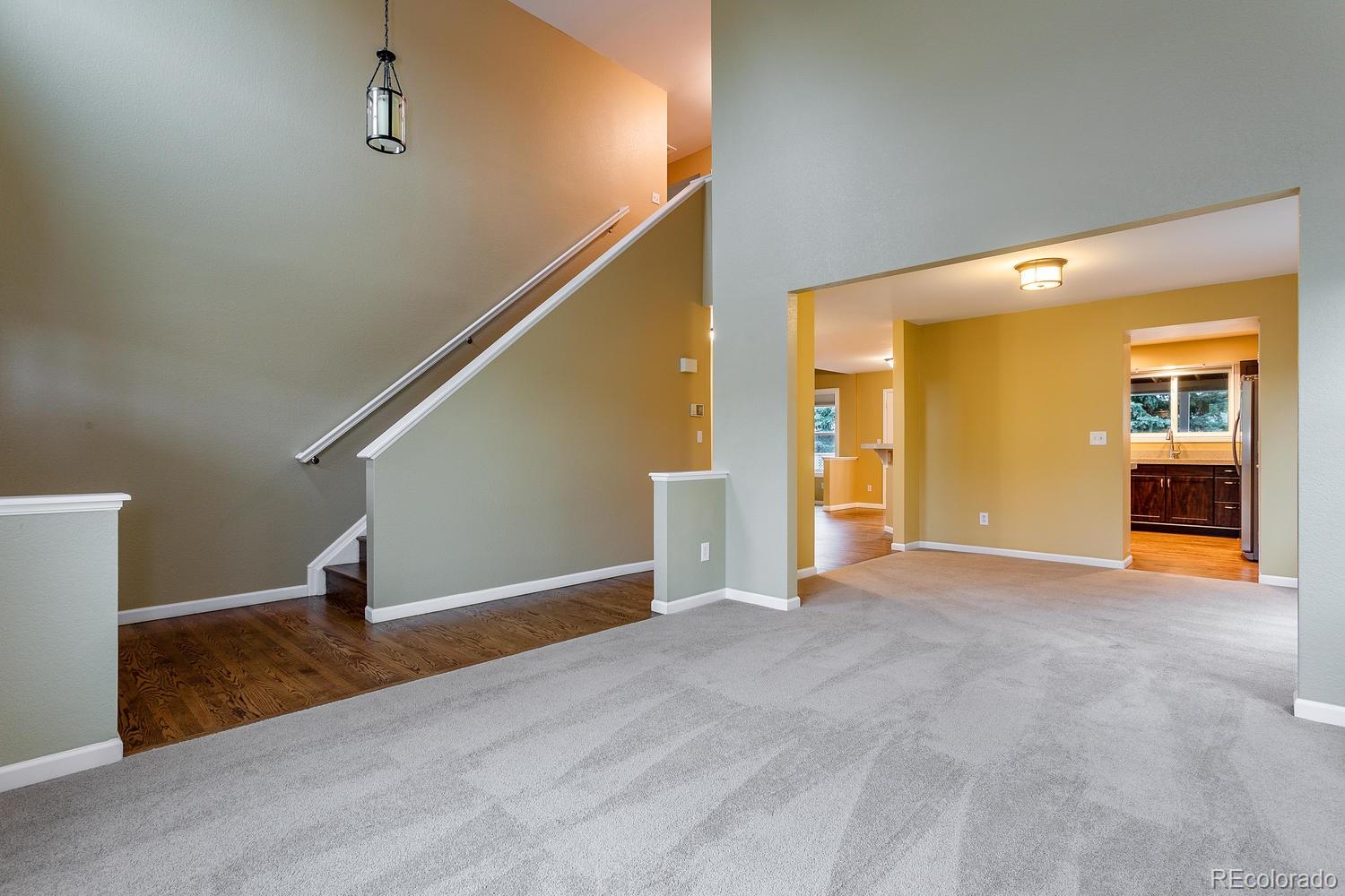 9869 Spring Hill Drive Highlands Ranch, CO 80129 - Photo 4 of 37 a view of empty room with wooden floor