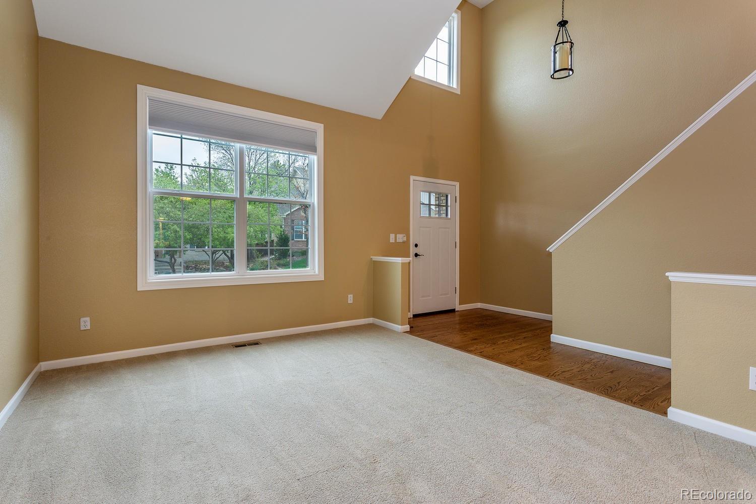 9869 Spring Hill Drive Highlands Ranch, CO 80129 - Photo 5 of 37 an empty room with windows