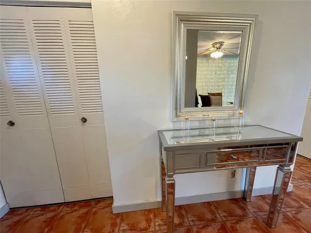 a view of kitchen with sink and window