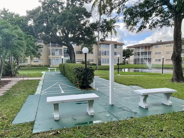 a view of a house with a yard porch and sitting area