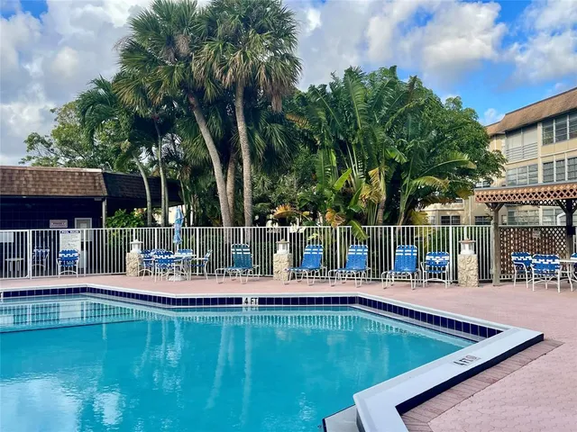 a view of a swimming pool with a patio