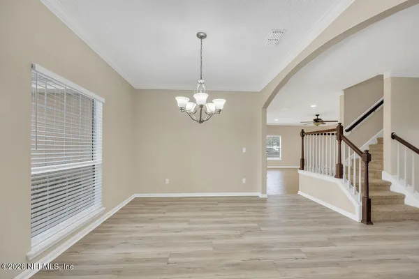 a large kitchen with kitchen island a sink stainless steel appliances and cabinets