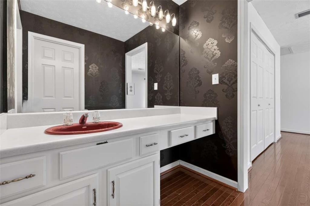 3035 Mt Zion Road Oxford, GA 30054 - Photo 67 of 99 a bathroom with a sink and a mirror