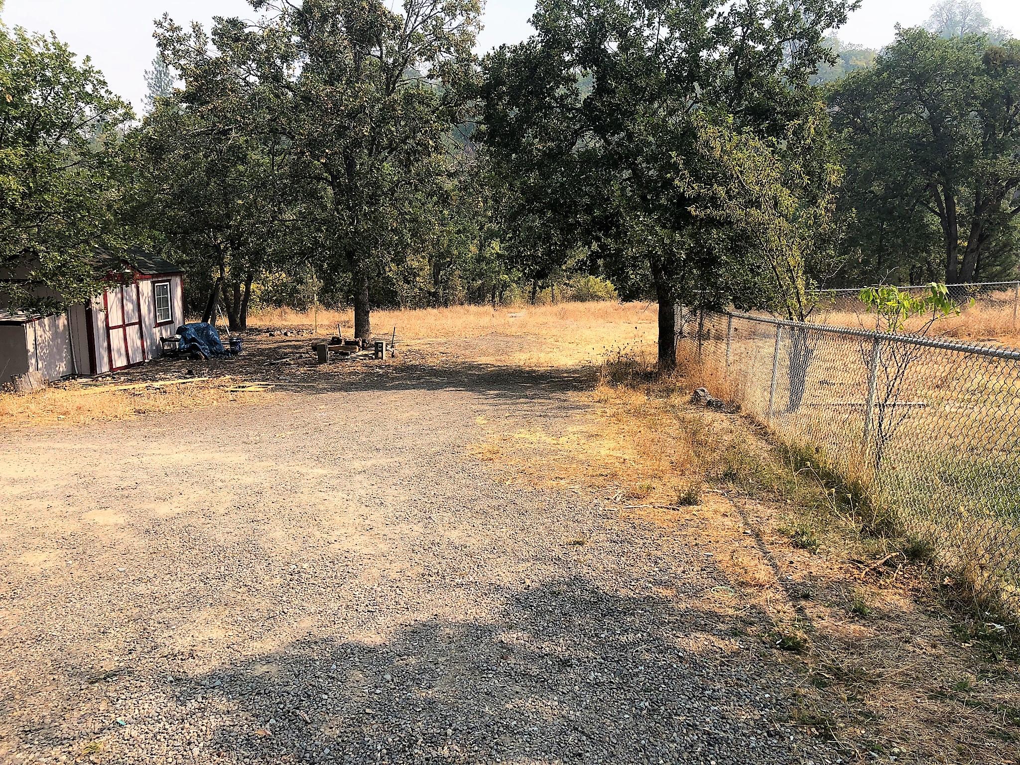 495 Alpine Road Eagle Point, OR 97524 - Photo 16 of 28 a view of a yard with tree s