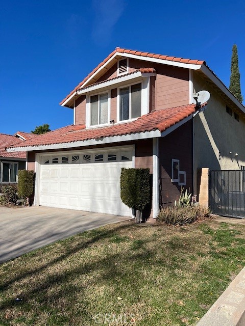1148 West Cornell Street Rialto, CA 92376 - Photo 1 of 21 a front view of a house with garden