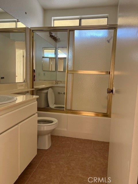 1148 West Cornell Street Rialto, CA 92376 - Photo 16 of 21 a bathroom with a shower a toilet and a sink