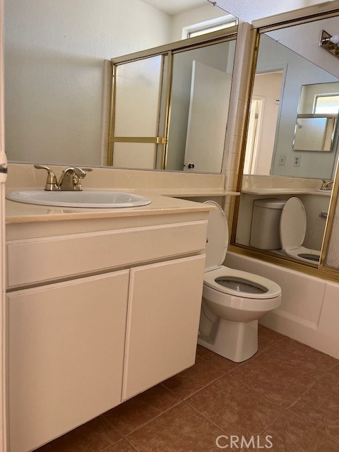 1148 West Cornell Street Rialto, CA 92376 - Photo 17 of 21 a bathroom with a toilet sink and mirror