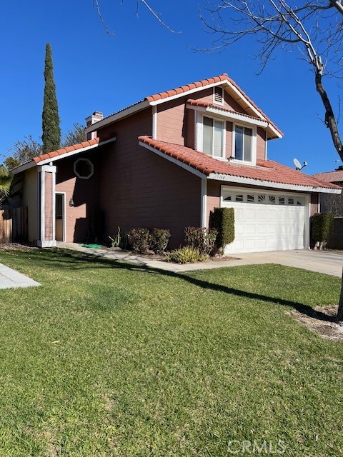 1148 West Cornell Street Rialto, CA 92376 - Photo 2 of 21 a front view of house with yard