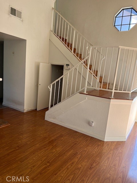 1148 West Cornell Street Rialto, CA 92376 - Photo 4 of 21 a view of staircase with white walls and railing