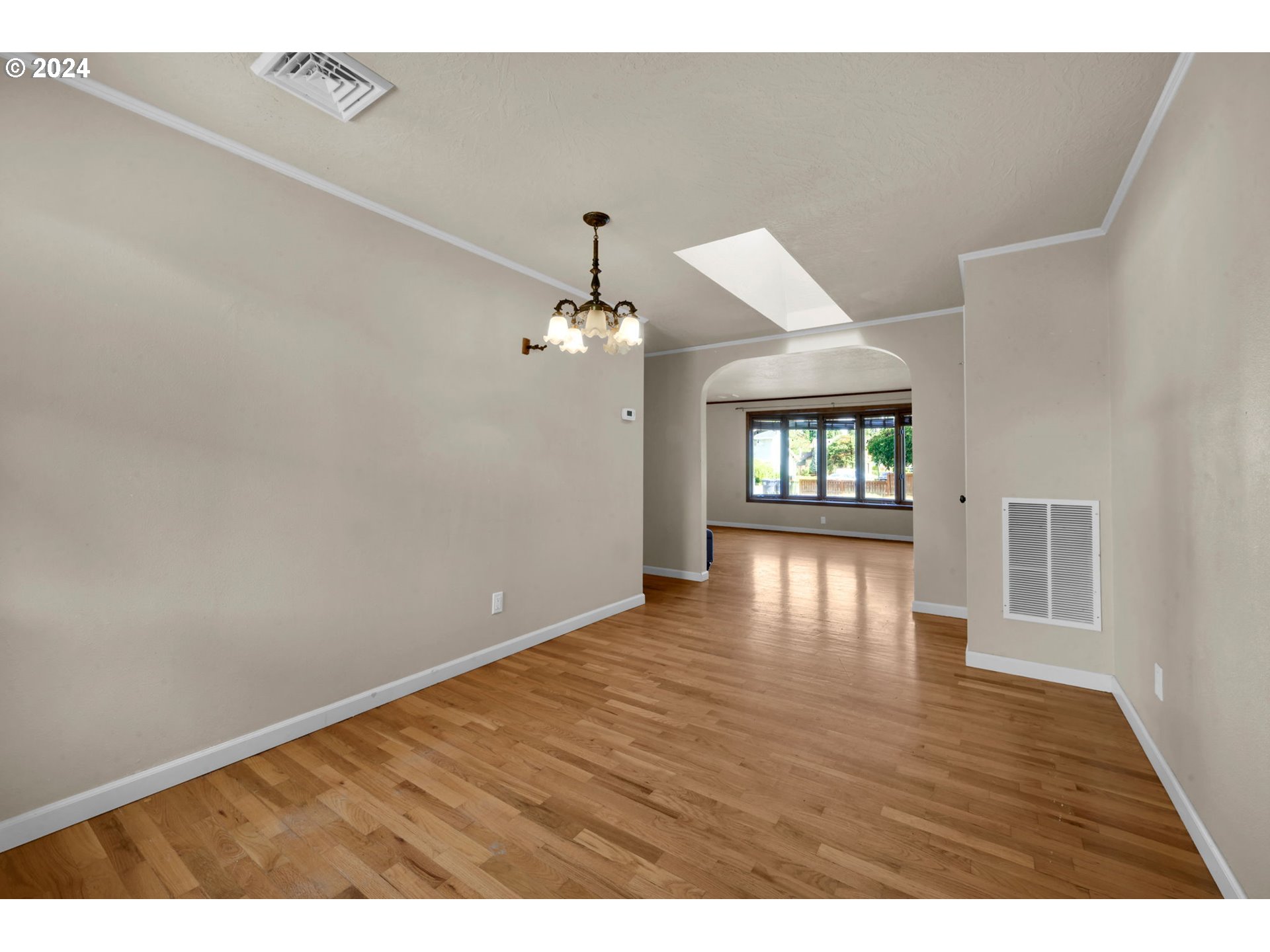 750 66th Street Springfield, OR 97478 - Photo 11 of 41 a view of an empty room with window and wooden floor