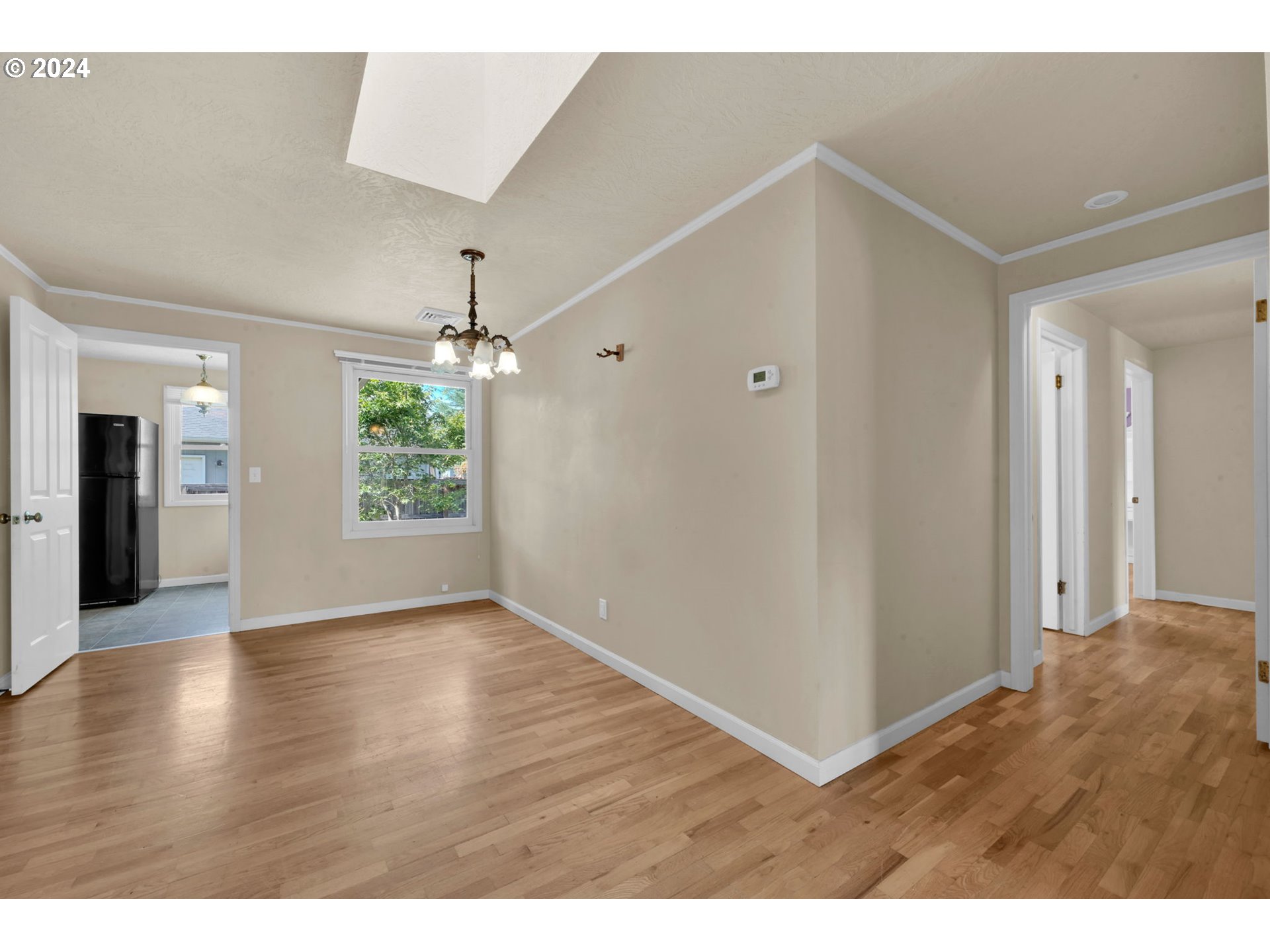 750 66th Street Springfield, OR 97478 - Photo 13 of 41 a view interior of a house with wooden floor and windows