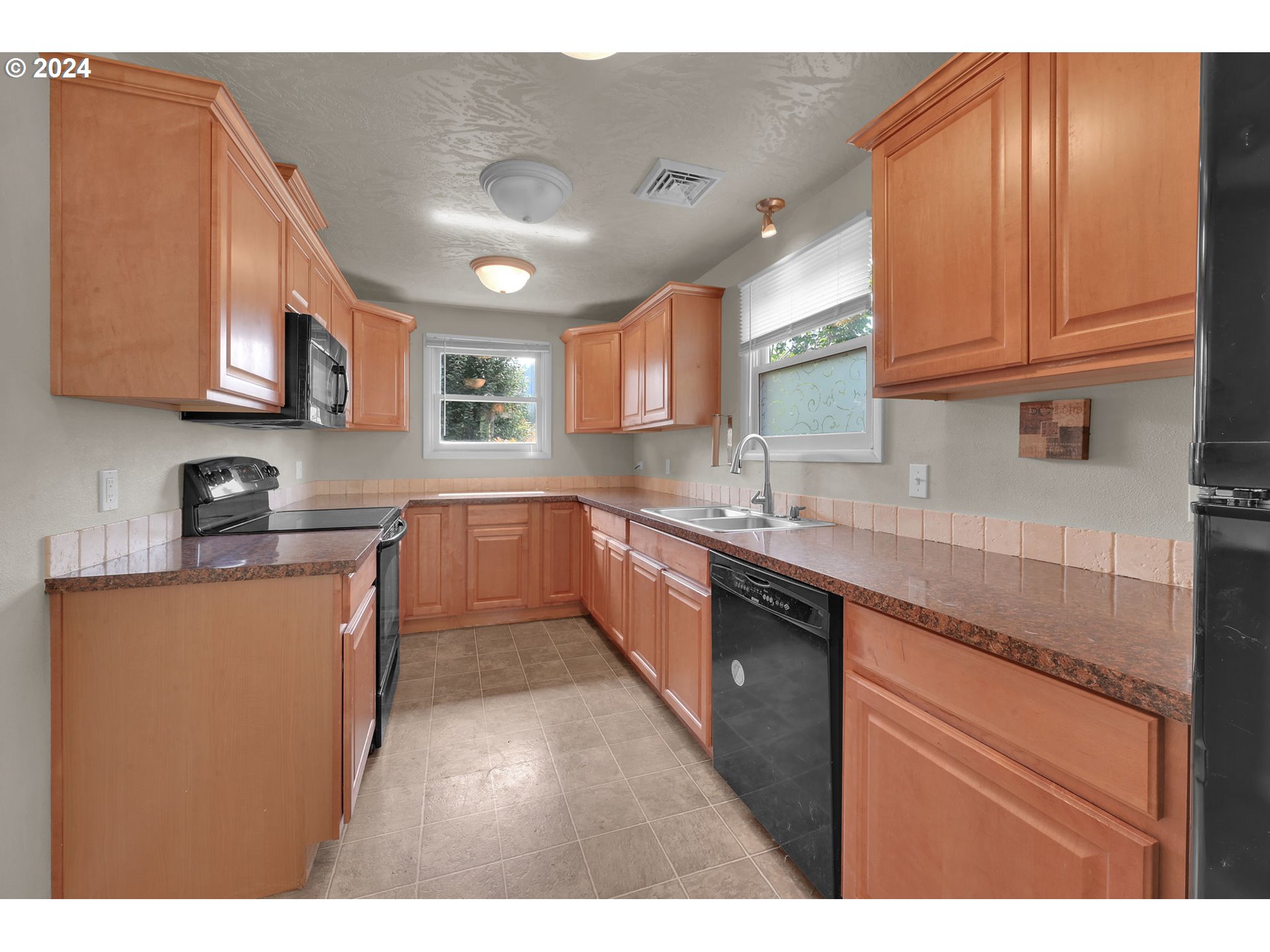 750 66th Street Springfield, OR 97478 - Photo 16 of 41 a kitchen with stainless steel appliances granite countertop a sink stove and cabinets