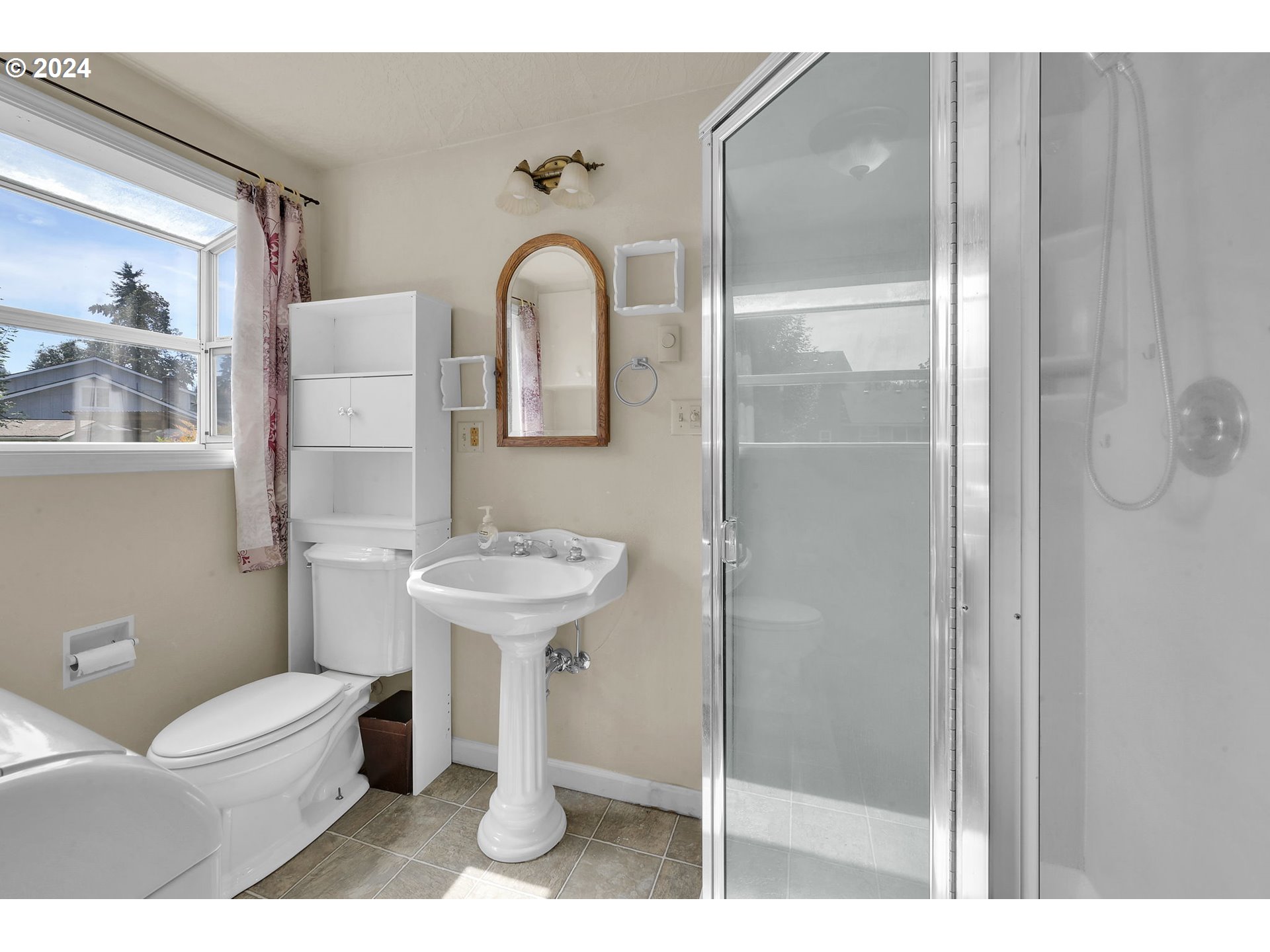 750 66th Street Springfield, OR 97478 - Photo 19 of 41 a bathroom with a sink toilet and shower