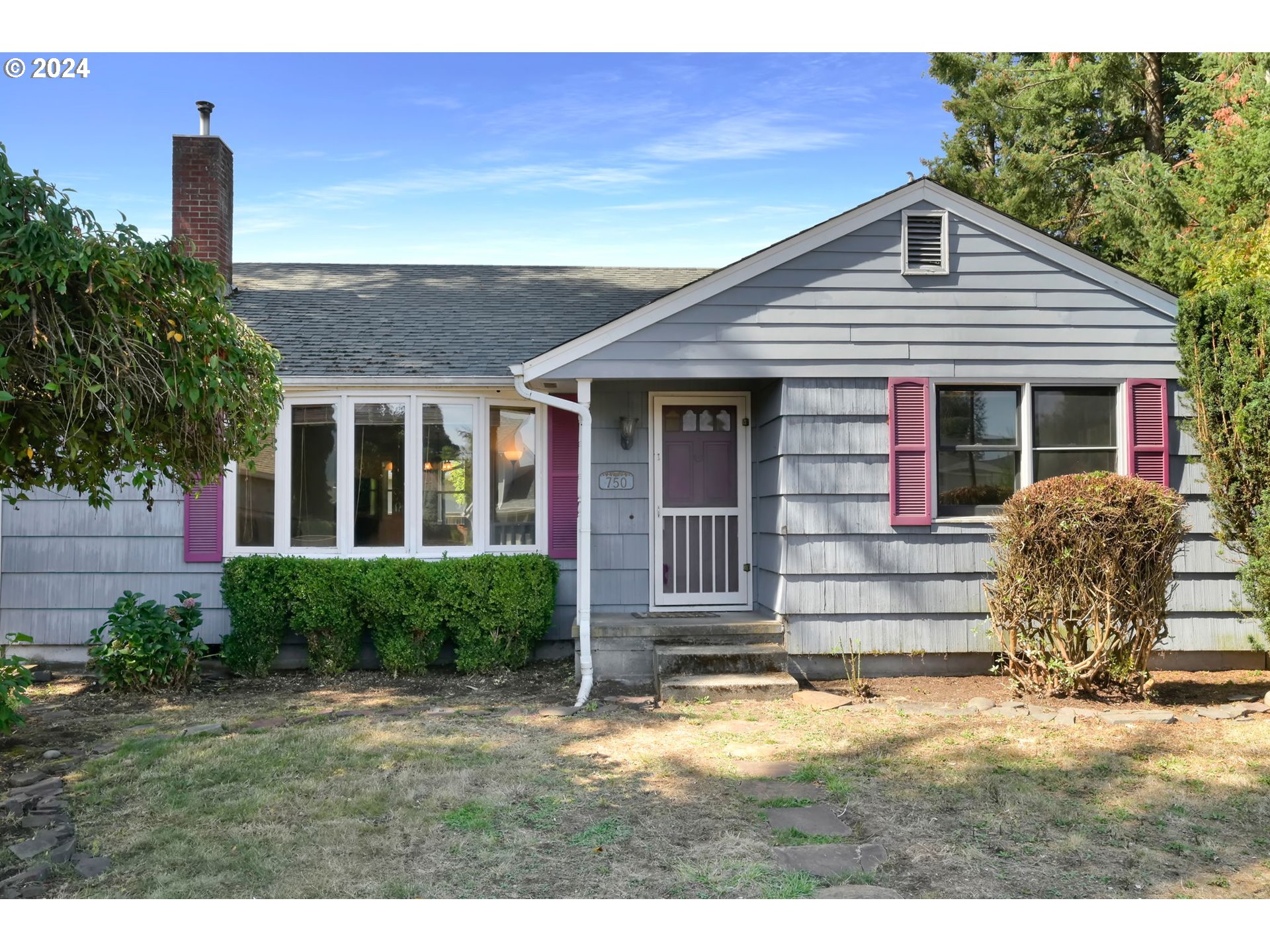750 66th Street Springfield, OR 97478 - Photo 2 of 41 a front view of a house with a yard
