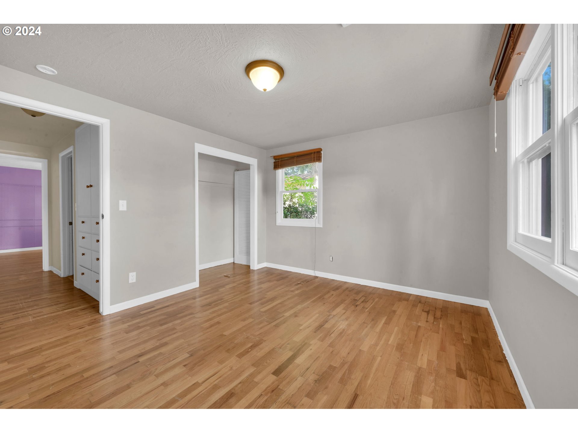 750 66th Street Springfield, OR 97478 - Photo 24 of 41 a view of an empty room with window and wooden floor