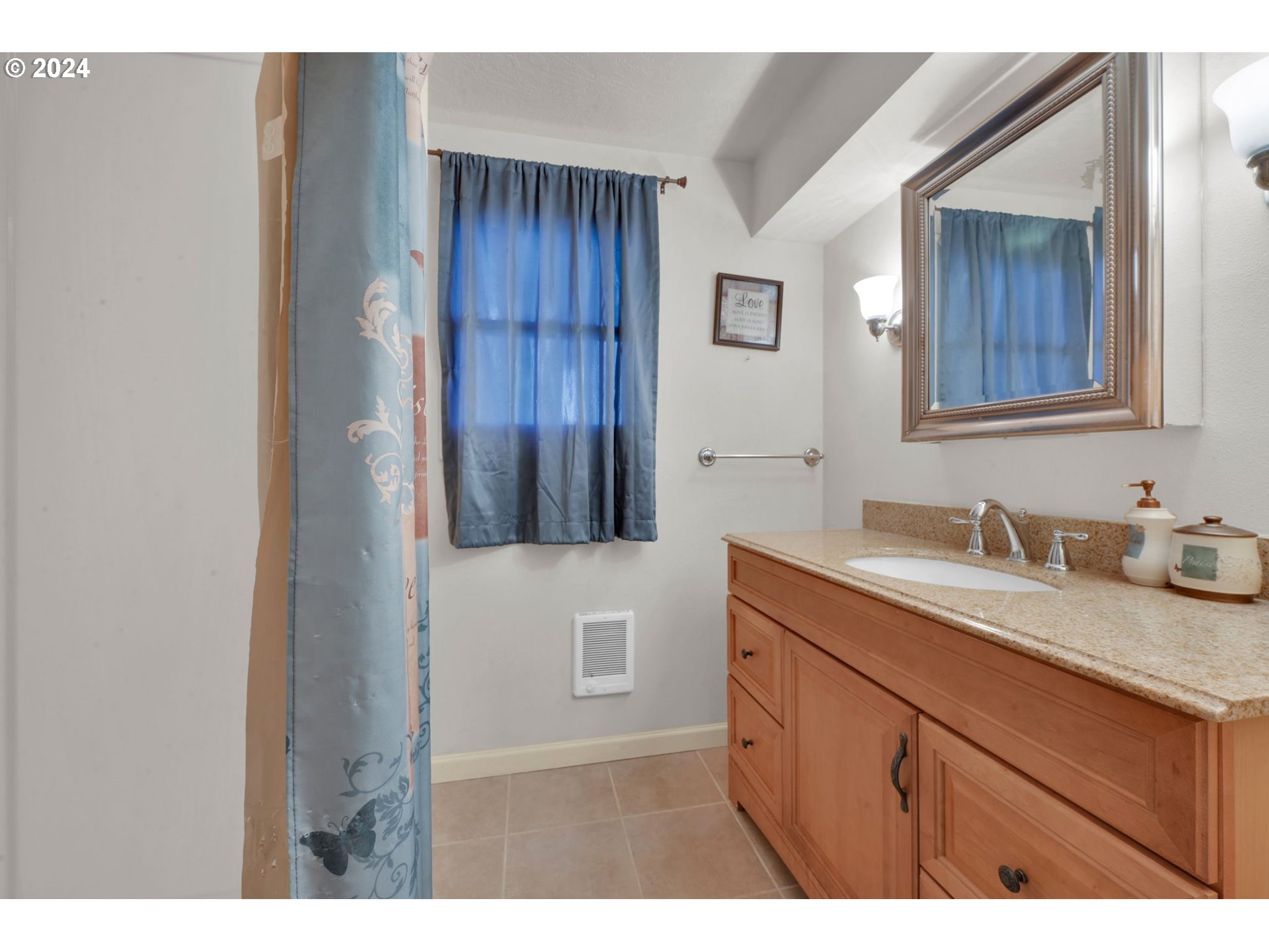 750 66th Street Springfield, OR 97478 - Photo 30 of 41 a bathroom with a sink and a mirror