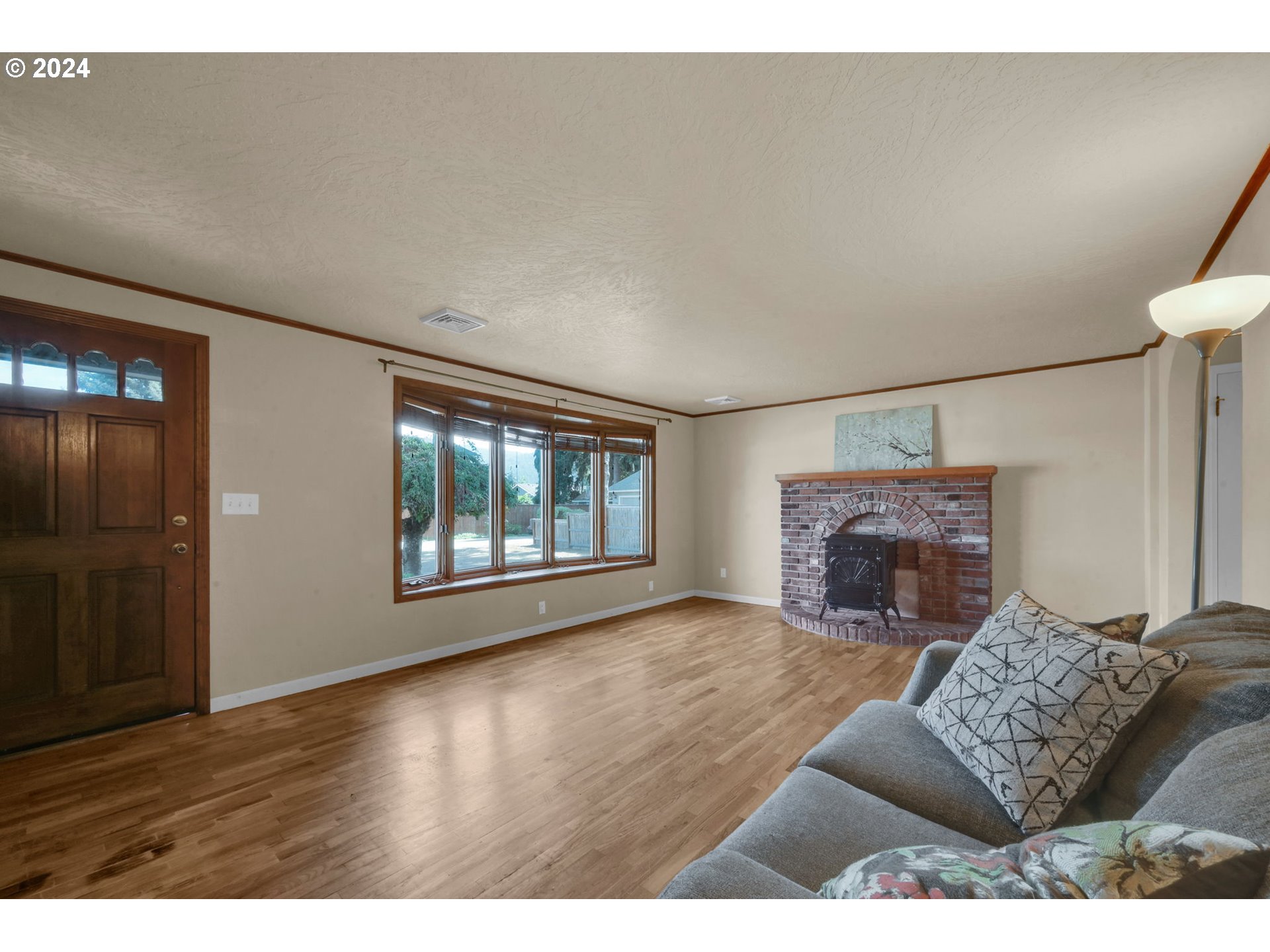 750 66th Street Springfield, OR 97478 - Photo 6 of 41 a living room with furniture and a fireplace
