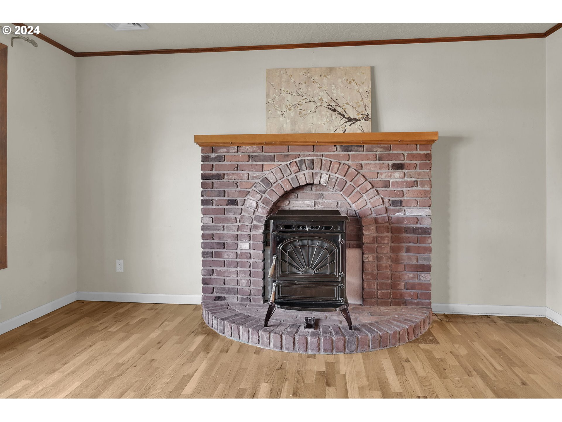 750 66th Street Springfield, OR 97478 - Photo 9 of 41 a stone fireplace with a mirror