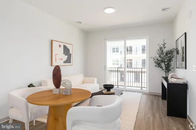 a large bed sitting in a bedroom next to a window