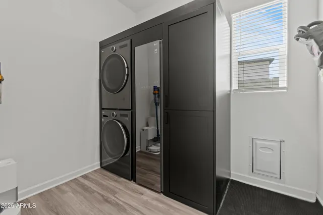 a bathroom with a granite countertop toilet and a mirror