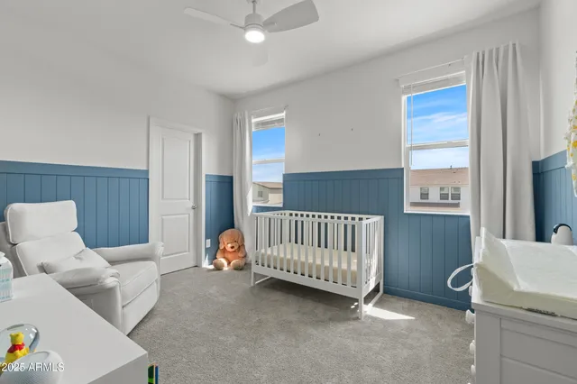 a bedroom with furniture and a window