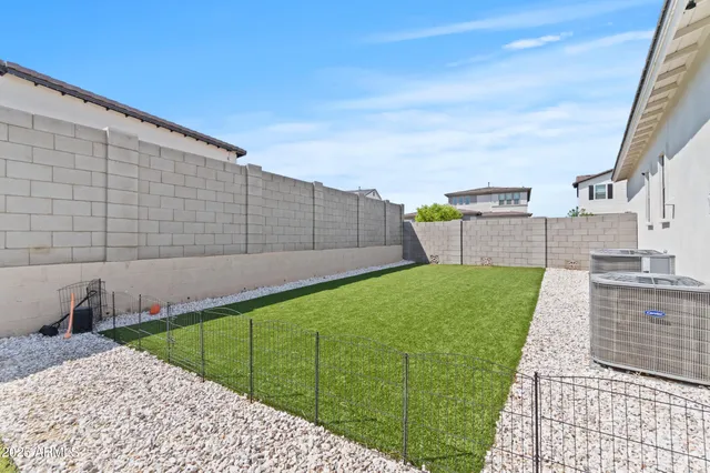 a view of a backyard with sitting area
