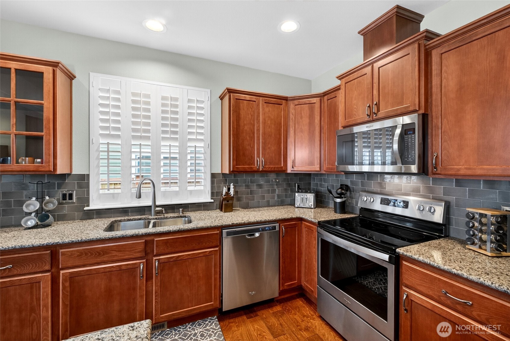 646 Mandee Street Southeast Lacey, WA 98513 - Photo 15 of 39 a kitchen that has a sink and a stove