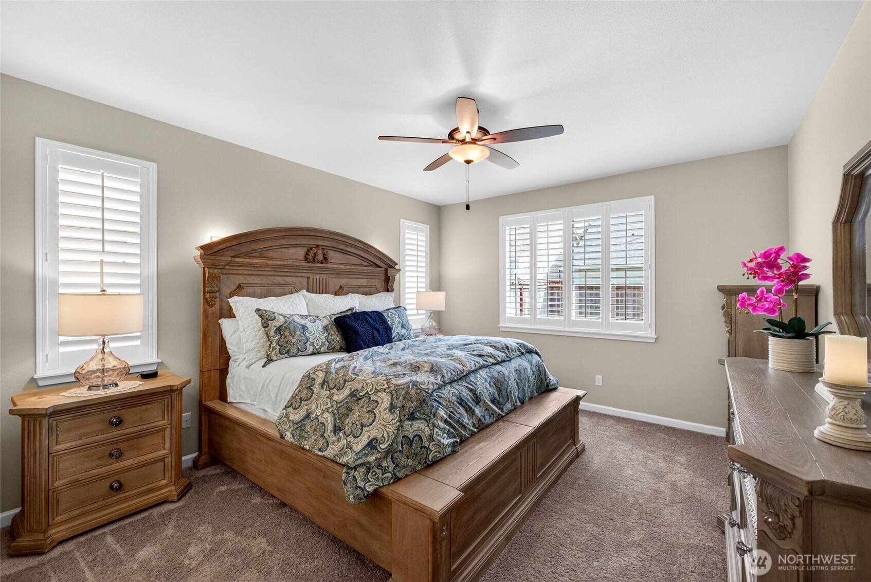 646 Mandee Street Southeast Lacey, WA 98513 - Photo 21 of 39 a bedroom with a bed and a chandelier