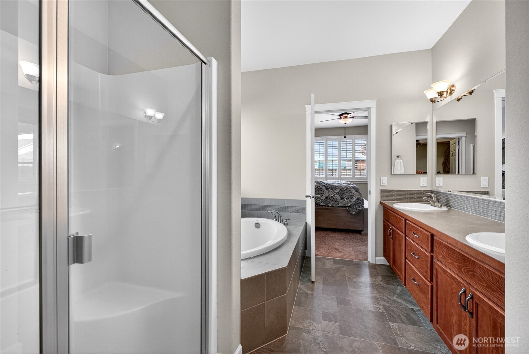 646 Mandee Street Southeast Lacey, WA 98513 - Photo 26 of 39 a spacious en suite bathroom with a granite countertop tub double vanity and a shower